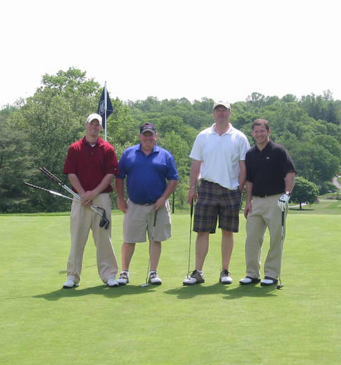 Four People On The Golf Course 